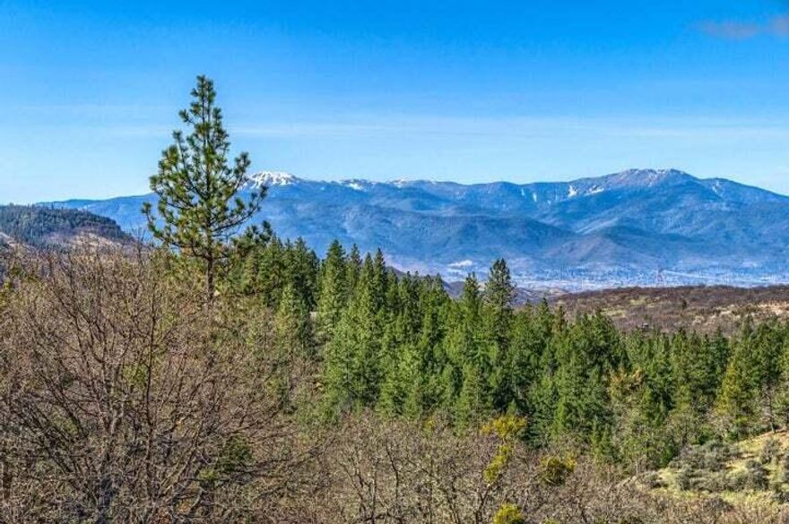 Spectacular views and privacy abound on this 122+ acre property situated just 8 miles and a short drive up the hill from the City of Ashland, Oregon. Home site approval has been applied for and is in process. This EFU zoned property offers varied topography with its canyons and seasonal creeks, oak grove, and unbeatable views from the ridgetop. Cooler in the summer and above the fog in the winter! Located close to mile marker 8 on Dead Indian Memorial Rd, making this the perfect location to live your off the grid dream while still only 15 minutes from the restaurants, shopping, and culture of Ashland. Buyer to do own due diligence.