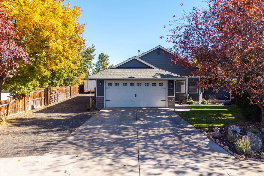 Nestled on a quiet cul de sac, endless opportunity awaits in this single level home. Thoughtfully positioned on an oversized .27 acre lot, this home blends pride in ownership, tasteful updates & exceptional outdoor living. Tall ceilings and smart design allow the home to live large & maximize its sq. footage. With generous storage, updated primary bathroom, lovely laminate floors and elevated lighting this home is both beautiful and functional. Generous use of picture windows captures natural light & makes the space warm/inviting. Outside enjoy a covered deck, water feature, garden area, RV parking and three storage sheds! Even better, a 24x30 standalone heated shop w/ 220 power  offers exceptional storage capacity. Fully fenced, enjoy no HOA and being walking distance to Dry Canyon & minutes from schools & dining. The perfect blend of privacy & storage for hobbies in the heart of town