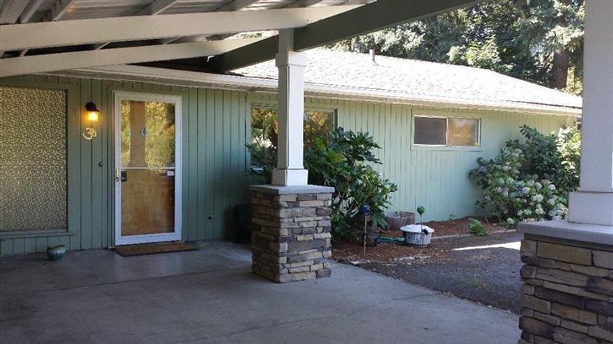 Beautiful View of the Rogue River! This charming home is nestled nicely amongst majestic trees and has a wonderful view of the Rogue River. Located on a quiet street in an area of nice homes just minutes to downtown Grants Pass. Nicely laid out floor plan allows you to enjoy the view of the Rogue River from many areas of the home or while sitting on your back patio. Gentle sloping lawn allows easy access to the River and is fenced entirely with chain link fence so that your children or pets may enjoy the large back area to play. The property is located just above Clam Bed Riffle, a fisherman's favorite. Must tour to appreciate!