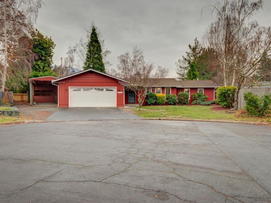 Hard-to-find 4-bedroom/2-bath single-story home in great condition on almost 1/4 acre in quiet SE Grants Pass cul-de-sac location! Recent remodeling includes new interior paint, new carpet, new range, and new dishwasher. The home also features large kitchen, dining room, family room, and step-down living room with rock fireplace and slate hearth, plus large covered patio and fenced back yard. There is not only an attached 2-car garage, but also a workshop and covered RV parking. Must see!