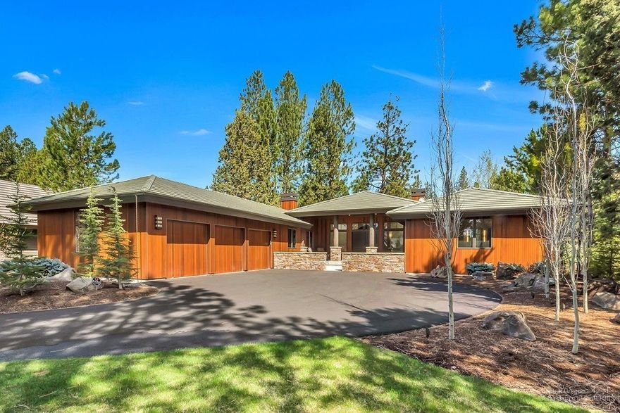 Exceptional single level in Broken Top. Prime location on the 3rd fairway offers privacy and a lovely view - no homes on the other side of the fairway! Home thoroughly remodeled in 2016, looks brand new. Hardwood flooring & teak cabinetry throughout entire home. Great room offers a vaulted ceiling w/ wood beams, handsome stone fireplace & large dining area. Kitchen features Alpinus granite counters & a huge island. Wolf range & micro, Sub Zero frig & wine frig, Miele dishwasher. Fireplace in kitchen makes it an ideal gathering spot in the home. Master has 2 walk-in closets & a barn door leading to a luxurious bathroom. Large den/office adjacent to master; 2 guest bdrms at other end of the home. 3rd bdrm has built-in bunks w/ 2 queen beds, each w/ twin beds above. Front & back covered patios are enclosed by low rock walls. Back patio wired for hot tub and has 3 gas connections for BBQ, heater or fire pit. Incredible curb appeal thanks to new landscaping, new driveway & new cedar siding!