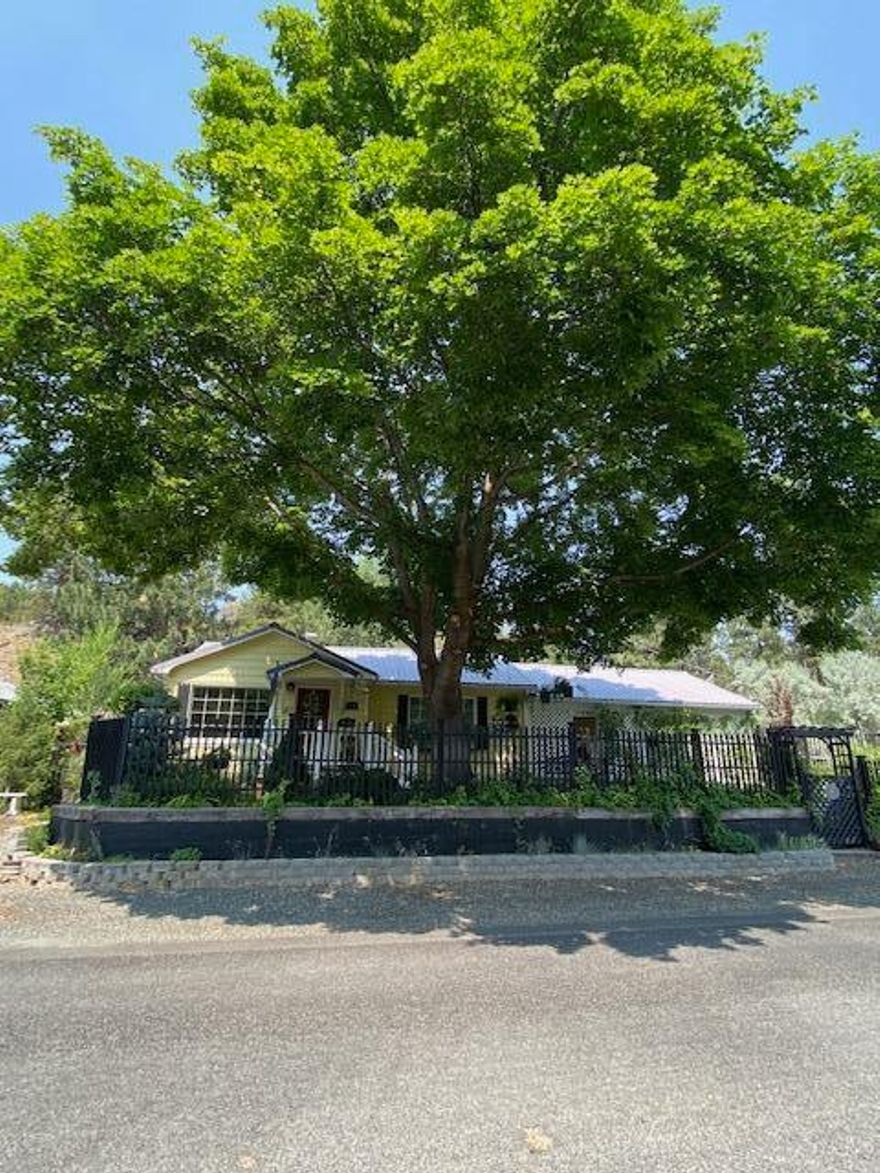 LOVELY COUNTRY HOME ON HUMBOLT!  Pride of ownership located on .23 of an acre w/curb appeal, open floor plan, 1866 sq ft, 3 bed, 2 bath, beautiful upgrades throughout, kitchen, dining room, living room, sun room & utility, tile, carpet & hardwood flooring, oil & electric heat, vinyl windows, french doors, patio, sidewalks & trex decking, immaculate landscaping includes beautiful flower gardens, raised beds & arbor, wood shed, 2 car carport w/storage areas & a wood shop.  $315,000