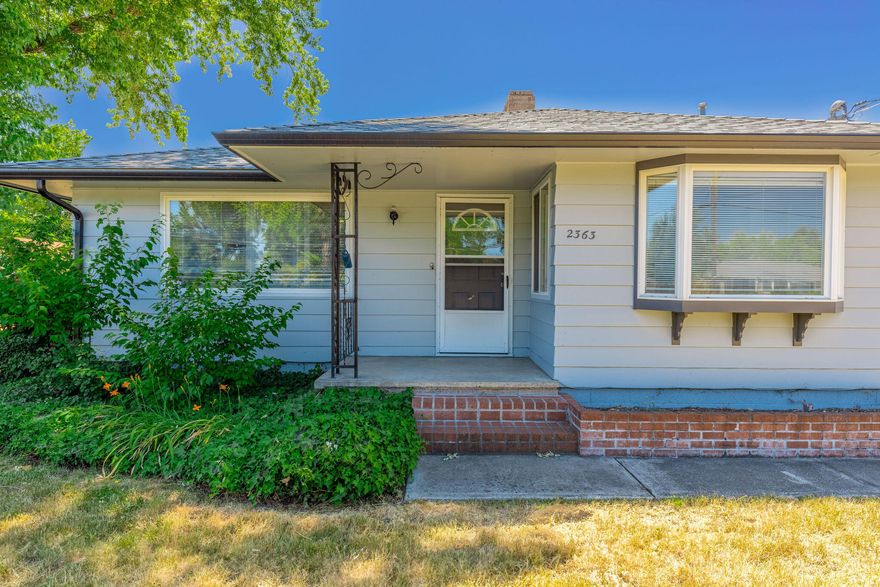 Wow!!  Here's an affordable home in a great area, on a large .26 acre lot! Home is in great shape,
 newer roof, fresh paint and  newer heating/AC system! Featuring 3 bedrooms, 2 baths- two bedrooms are in the hallway with a bathroom between and off of the kitchen there's another big bedroom with it's own bathroom and separate entrance to the  back yard.  There is plenty of room to garden in the fenced back yard, a covered RV parking area and large back patio! Backyard also has a storage shed and possible animal pen.
 Close to shopping, schools, entertainment and the new aquatic center- and it's not on a busy street! 1 year home warranty with First American is offered to the buyer.