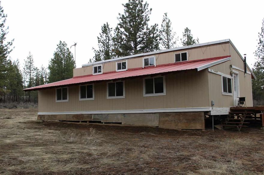 Remote Owner Built Home In Sprague River. 3 Bedroom 1 Bath With Off The Grid Features Such As Limited Solar Power And Small Windmill, Propane Log Heater, Fridge & Range In Kitchen, And Cast Iron Well Pump. Home Has A Metal Roof And Deck. Two Lots Included In This Listing With Trees And Good Access.