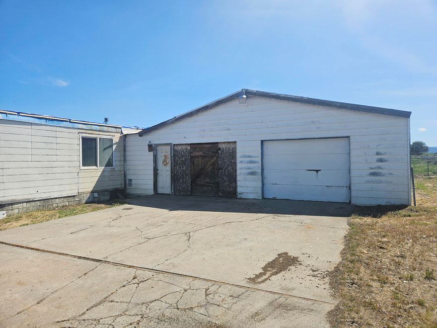 1 Acre just outside of the town of Bly. It has an oversized garage with extra storage room. There is a 1971 double-wide manufactured home on the property that is not owned by the seller. Manufactured home title will not transfer to the buyer at closing.
