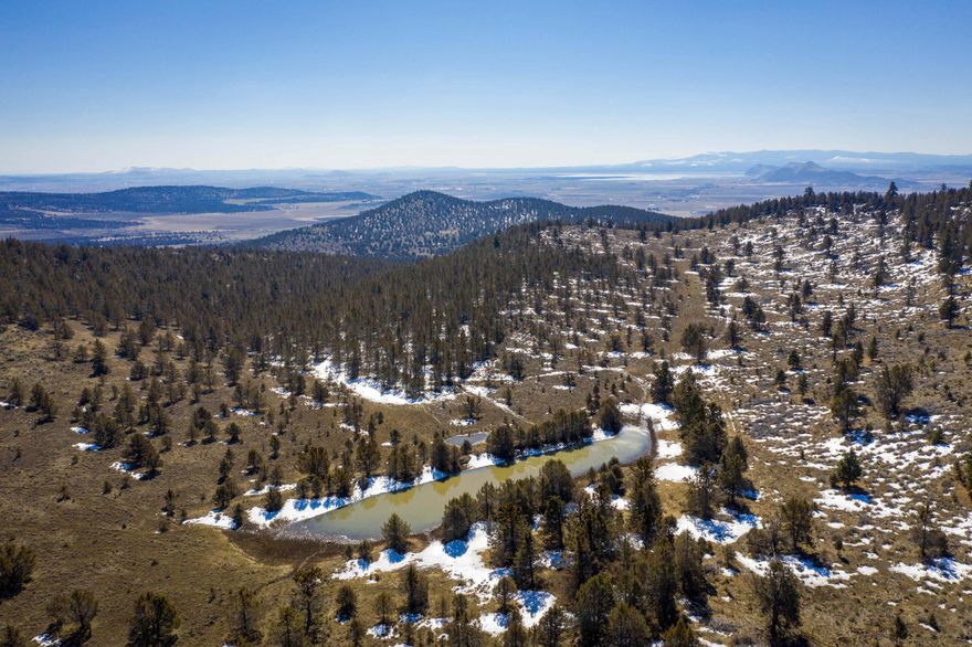 Parcels: 895073, 895075, 104256, Consisting of 1850 acres on Dodds Hollow Road, Merrill Oregon.  The land has been dormant for a number of years but portions have grown potatoes. There has been an apple orchard and alfalfa and grain are grown on nearby land. The land is currently being leased for grazing 80 to 90 head of cattle. There are 3 reservoirs on the property and several seasonal streams.  The reservoirs and a couple of the streams generally have water year around accept in very dry years. There is a domestic well that hasn't been used for years and needs work.  There is an active permit (P-81575) for a commercial well but no well has ever been drilled.  Buyer to do due diligence on the process required for both the commercial and the domestic well. There is power at the street but none on the property.  The property surrounds 200+ acres of BLM land which is leased annually for a nominal sum.  There are beautiful views of Mt. Shasta the surrounding mountains and valley.