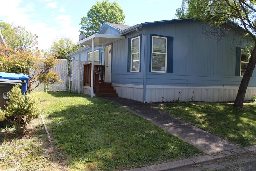 Great family home in Butte Crest Park. This 3 bedroom/2 bathroom home offers a split floor plan, vaulted ceiling, open kitchen with center island, spacious dining room, and large living room.  Upgrades seller had completed- understructure of home was re-leveled, new paint inside, new bathroom counter tops & sinks, new flooring in Kitchen, new tile floor in primary bathroom,!closet doors, and new back door.  Appliances included are fridge, range/oven, and W&D. This family park has lots to offer, come check it out!!