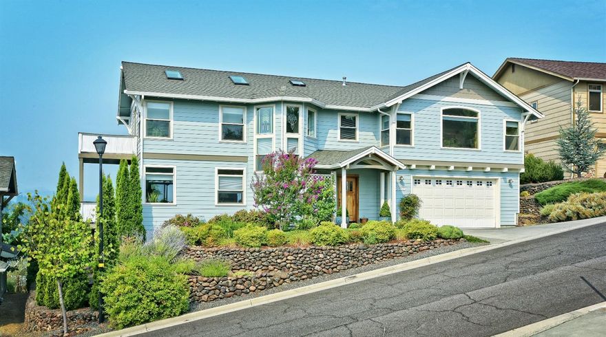 On a hill halfway between Ashland and Medford, this beautiful contemporary home offers a magical setting. Enjoy Mt. Ashland and Table Rock views while overlooking the pollinator garden below. Designed by a master gardener, the garden offers year-round color and beauty, and refuge for butterflies and frogs.Large windows, skylights, high ceilings and ample wood create a light-filled yet welcoming interior. Tiffany-style chandelier, smart'' fireplace, Hunter Douglas window coverings and other quality features reflect attention to detail and timeless quality. The spacious tiled kitchen has newer stainless appliances and walk-in pantry. A main-level living room with cozy gas fireplace and family room/library upstairs offer plenty of space for entertaining or quiet relaxation. The three bedrooms have large windows and skylights. The private master suite has a large soaking tub with views of the valley below, and a spacious walk-in closet. Come see why the sellers call this home Sky Castle!