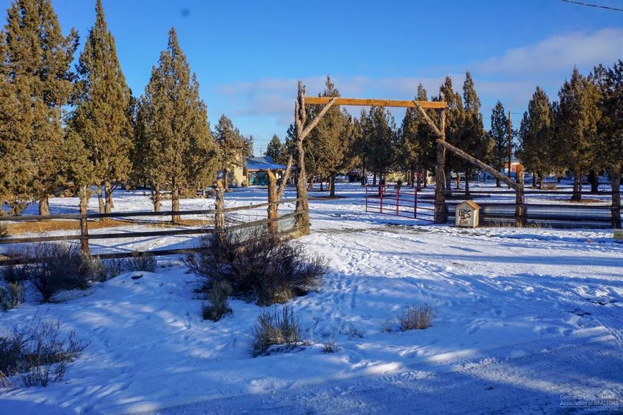 Nice home on small acreage, completely fenced with archway entrance. Interior has some custom touches with tile and laminate throughout most of the house, carpet in upstairs bedrooms.