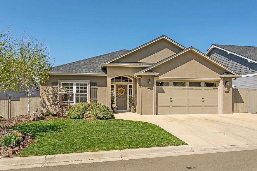 Beautiful Mahar built home with many custom features located in desirable Eastgate Subdivision. This meticulously maintained home has three bedrooms, two bathrooms with sought after split floor plan. Come enjoy this home with coffered ceilings, gorgeous built-ins, rounded archways, crown molding and hickory flooring. Kitchen boasts granite counter tops, built-in booth seating, hutch, gas cook top and stainless appliances. Master bedroom is equipped with his and hers closet and a lovely en suite. Home Theatre upgrade with surround sound with speakers to the outside patio. Backyard has been built-up for privacy with attractive mature landscaping, inviting patio finished with custom pergola, storage shed is located on the side of the yard. Two car finished garage with ample storage. Come admire this well maintained, one owner, East Medford gem!