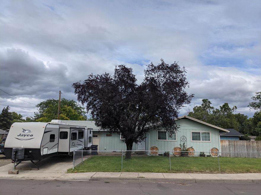 This 1100 sq. ft home features 3 bedrooms and 2 bathrooms.  The home has been remodeled inside with new doors throughout, new flooring, new air ducts, all new baseboard molding and new paint throughout.  The kitchen has plenty of cabinets and counter space as well as stainless steel appliances.  Large living room with natural light as well as a fireplace.  Three large bedrooms make up this home.  Outside you will find a large yard, room to grow a garden and extra long RV parking.