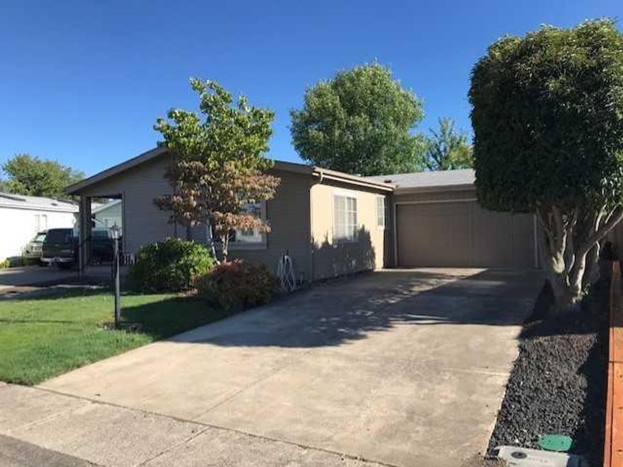 Come to the Meadows and own your own home and the land. A 55 an older community that offers numerous amenities. Spa, pool, two community centers, walking trails, billards room and much more. This home offers open floor plan, vaulted ceilings, built in china cabinets and corner pantry. Master bedroom is expansive and the master bath offers two counters and two sinks. Additionally there is new interior paint, wall to wall laminate flooring and carpeting in 2017. In 2018 a brand new HVAC unit was installed and the exterior was painted. Relaxing patio, sprinklers for the greenery and nice sized two car garage. Join this coveted community.