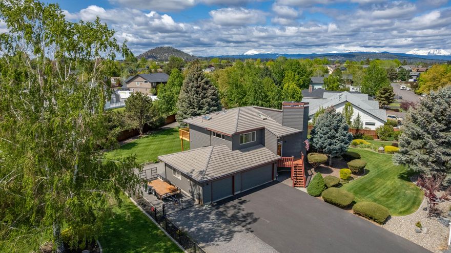 Owner will carry for 12 mths @ 4.5% with $300k down! This beautifully maintained 2200 sq ft, 3-bedroom, 4-bathroom home offers a rare combination of comfort, space, and amenities on a .53-acre, fully fenced lot, complete with manicured landscaping and mature trees. 2 Primary Suites, ideal for multi-generational living or hosting guests in style. Kitchen features travertine counters and flooring, very spacious pantry & an island with a 5-burner gas stove.  Cortec luxury vinyl flooring throughout the living areas, bathrooms and staircase. Custom powder coated handrail on the staircase, new window treatments that open to some mountain views, remote sunshades, new pavers out back & a brand new cedar deck with a pergola for entertaining or relaxing outside. Roof has concrete tile, which is not only durable, but stylish
 with lasting value, which is a huge plus in Central Oregon. Park your RV right up to the home in the RV parking/access. Don't miss out on this rare gem.