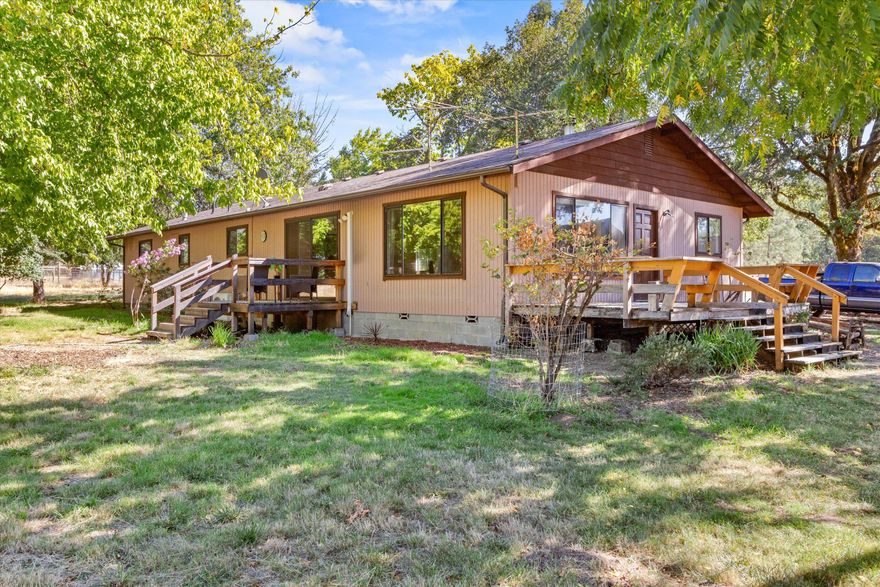 This rare and incredible opportunity to own over 15 acres of flat and usable land in Hugo does not come up for sale often! Make your move on this home with over 2000 sqft of living space on over 15 acres of prime land! Brand new roof just installed! Featuring a home with 3 bedrooms and 1 bathroom and a large barn, private driveway, and plenty of room for animals, family gatherings and so much more! The property is cross fenced for horses or livestock, also has a carport for storage. There is also a small creek at the back of the property. Don't wait to tour this home, make an appt today!