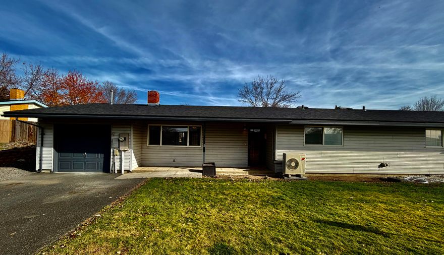 This energy-efficient duplex condo in the gated Falcon Heights community is move-in ready, with a Rheem tankless water heater, mini split ductless system, plus primary forced air system to help keep utility costs down. Fresh interior paint and exterior trim paint give this cute home a clean, crisp look. Kitchen features a large pantry and stainless appliances, and connects to the utility room with front load washer and dryer. Bedroom closets have ClosetMaid systems to help you organize. Previous owner converted the garage into a large bonus room plus storage in the front. Outside, you'll find a large, fenced, terraced backyard that's a blank slate, ready for your vision to bring it to life! It has alley access and a storage shed, with a patio and views of the hills for outdoor entertaining. There's additional off-street parking and a 10x20 concrete pad ready for a carport. New roof in Fall 2024.