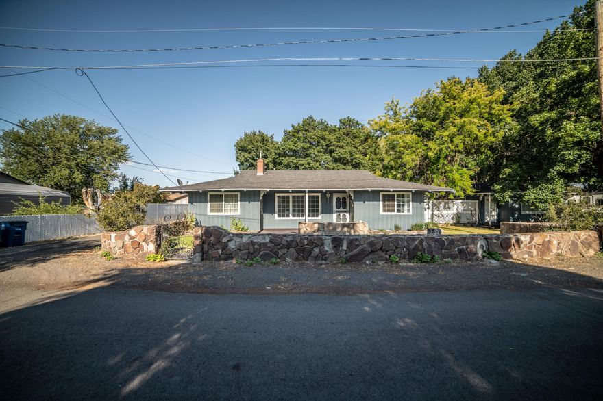 Located in the heart of Prineville this unique property has a 3 bed 1.5 bath home has lots to offer!  Nicely landscaped this property has been income producing and has a cottage that is 1 bed, 1 bath with all appliances and laundry area, and tenant would like to stay (currently rents for $950 per month).  There is also a detached guest house that has a full bathroom, laundry room and is attached to the garage.  Shared well services all 3 units and property is on city sewer.  Don't wait! Schedule a showing today!