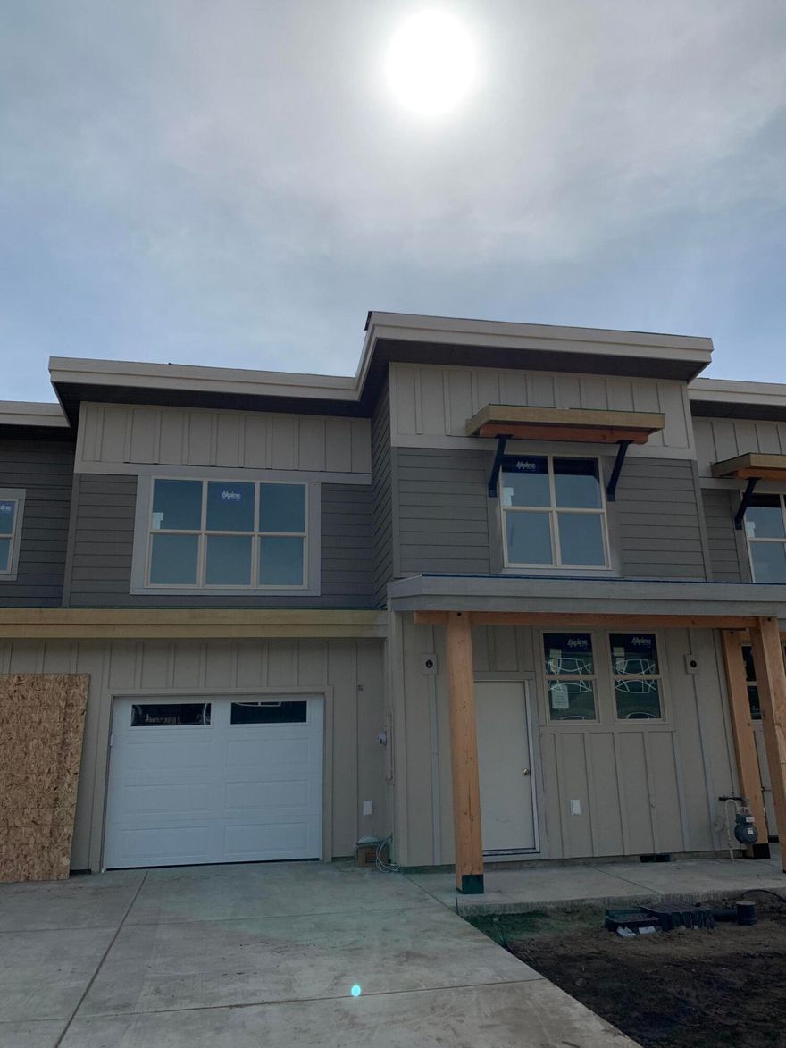 This beautiful new upscale townhome features  stainless steel appliances, iced white quartz countertops, pecan Paradigm Performer vinyl plank floors, nickel finishes, and a gas fireplace.  The heart of the home kitchen features bark classic mantra cupboards, a downdraft range, dishwasher and microwave. A/C ready for the summer!  Plenty of space for all your hobbies in this 3bed/2.5 bath home and the vaulted ceilings on both floors make it feel even roomier.  The laundry is conveniently located; see attached floor plan.  The extra long garage has a steel door with glass and room for storage or a workbench.  The fenced yard and south facing back patio are perfect for pets and  BBQs with your friends and family.  Conveniently located in a new neighborhood near Ridgeview HS.  Open Houses often or call for an appointment because they are under construction. Pictures of a similar home already finished. Visit soon!