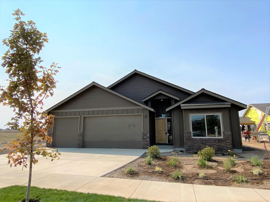 Situated in NW Redmond, this gem is Brand NEW & just completed w/premium finishes throughout. Single level, Great Room concept w/gourmet style kitchen, huge central island & Quartz counters thru out. Full height tile back splash, Stainless Steel appliances. Waterproof Plank style flooring in main living space. Custom wrought iron & modern ledge stone surround on gas fire place, built in TV & entertainment system spaces. Luxurious Master Suite w/tiled floors, Quartz counters, tiled shower w/glass door & walk in closet. Spacious walk in pantry, laundry room w/cabinetry. Art niches, ceiling accents, custom window coverings available. Oversized garage & extended drive way to accommodate larger vehicles or toys! Landscaped, covered back patio, sprinklers & A/C installed too. Back yard borders the Dry Canyon park. Call for details!