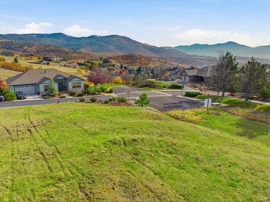 Located in East Medford's prestigious Highland Estates neighborhood! This exceptional .29-acre corner view lot sits high above the city at the top of Cherry Lane, offering unobstructed and panoramic views from the southwest ridge of Roxy Ann Peak. Enjoy stunning vistas of Mt. Ashland to the south and spectacular Rogue Valley sunsets over the western mountains. The elevated setting provides the perfect foundation for your custom-built dream home, with ample room for a pool, RV parking and the creation of an outdoor paradise to fit your vision. Located close to medical facilities, shopping, golf, parks, scenic trails, and popular dining! Bring your vision to life and create the home you've always imagined in one of East Medford's most sought-after settings!