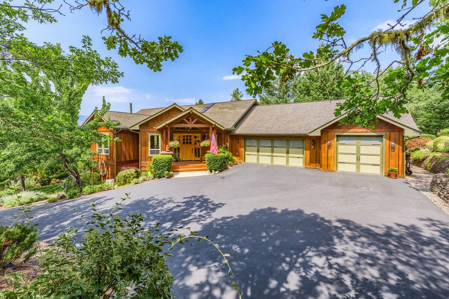 SELLERS ARE ENTERTAINING BACK-UP OFFERS. Stunning Northwest Style home on private 5.14 acres, with RV garage. The  home feat 4539 sq ft, open great room, wood trim thruout & a wall of windows to enjoy the views & bring the outdoors in! Main level consists of living room with woodstove, built-ins & cherry flooring,  formal dining room, kitchen with granite counter tops, pantry, breakfast bar & wine frig, primary ste, with fireplace, French doors leading to back deck, luxury bath & custom walk-in closet with washr/dryr..  In addition, there is a 2nd bedroom and half bath.  In the lower level, you will find a living room, exercise rm (or office), guest bed, full hall bath, plus a 2nd primary ste with it's own sitting room. Nice private space with it's own entry. The grounds are spectacular with a cascading waterfall, lovely walking paths, sitting areas & rock walls.  Ext feat also include, a 42 x 22 RV garage w/14' door, attached 3 car garage, sheds, paved drive & gated entry