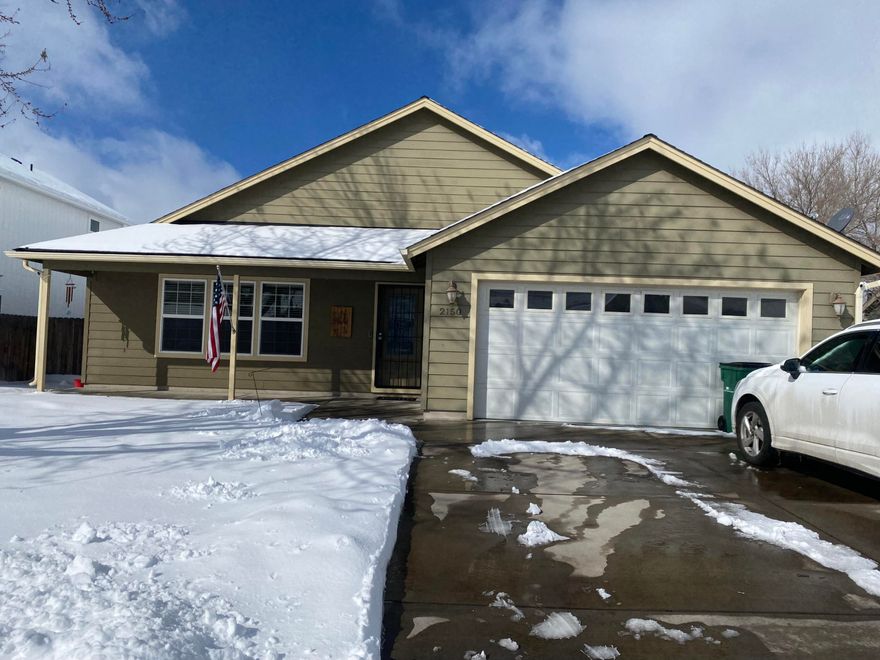 Gorgeous move in ready 3 bedroom 2 bath home in a desirable neighborhood. With views of Hogsback, this home boasts vaulted ceiling, a gas fireplace insert, central air and central gas heat. The kitchen offers stainless steal appliances, a nice pantry, and tons of storage. The spacious primary bedroom has vaulted ceilings, a walk in closet, and an ensuite with a double sink vanity. The fully fenced backyard has a large concrete patio perfect for entertaining, a beautiful retaining wall, and lots of privacy. The in ground sprinkler systems in the front and back yards provide low maintenance lawn care. There is plenty of parking with a double car garage, large driveway and room for RV parking on the side. This house is a must see! Schedule your showing today!