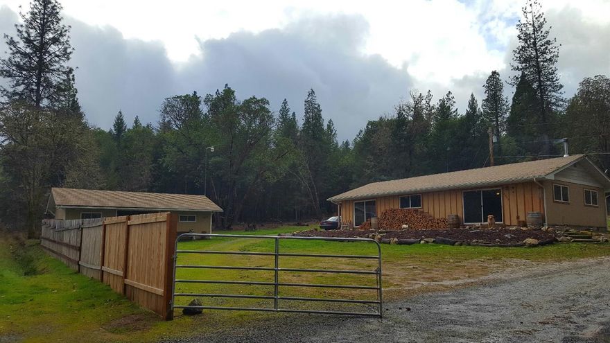 This is a very nice, cozy, newly updated two bedroom house, Move in Ready!! It has an open floor plan with great natural lighting. It's tucked away in a well maintained forest. Theres lots of room for the animals to roam, and lots of potential. This property backs BLM, and even has a quad trail to the top of the property for your convenience. Property is zoned WR. The Property next door is also for sale, zoned WR.