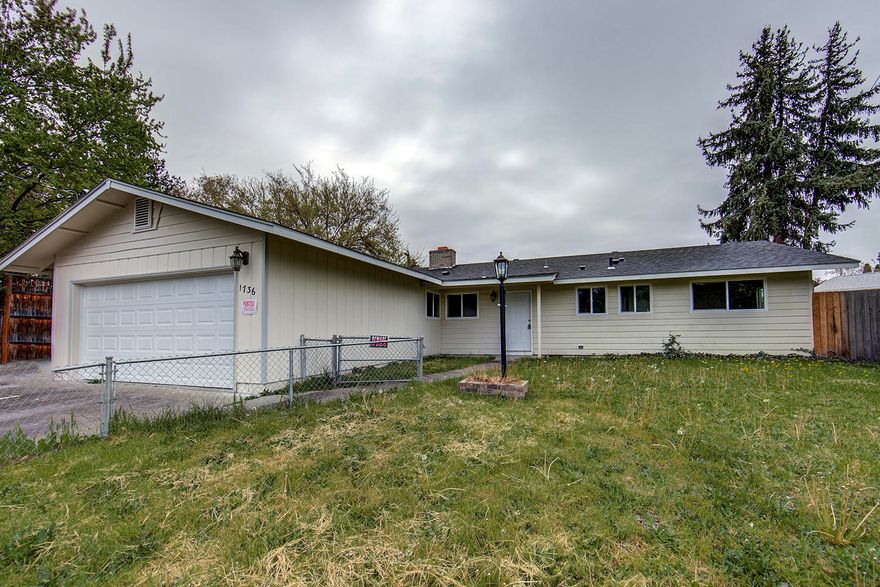 Beautiful three bedroom, two bath home in East Medford.  The home boasts a modern kitchen and many recent updates.  Some updates include: new carpet, new paint, new HVAC system, new hot water heater, newer windows, and a newer roof.  The spacious living room features a brick fireplace.  Access to the back patio is through sliding glass doors.  A two car garage provides plenty of off street parking.  Listing agent is manager of selling company and has an ownership interest.