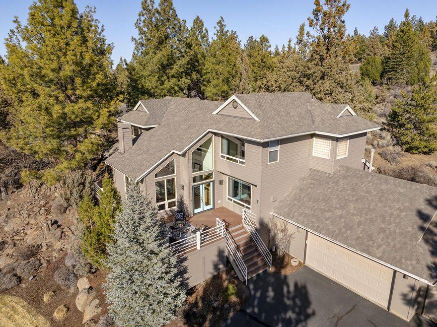 Offering an unbeatable private location at the end of a cul de sac within the desirable gated community of Awbrey Glen, this spectacularly updated, contemporary home is nestled perfectly on almost an acre lot to take advantage of breathtaking views of the Cascades.  The spacious front yard with mature trees & natural rock outcroppings lead to a wrap-around deck & backyard oasis with hot tub to take advantage of exceptional outdoor privacy.  Expansive & abundant windows frame the scenic mountain vistas in almost every room while flooding the interior with brilliant natural light.  A new kitchen with gorgeous walnut cabinets seamlessly connects to the family room and separate dining area, creating a wonderful setting for cooking & entertaining.  Each bedroom has its own en suite bath including one on the main level.  Easy access to walking trails & golf course amenities!