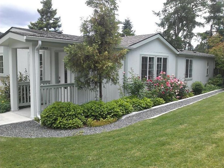 Beautifully rebuilt manufactured home in the best park in town. Totally-New everything, a real treasure on a double sized lot with mature landscaping. Beautiful alder kitchen cabinets, granite counters. Kitchen (10x10'10) features new stainless steel appliances & pantry, Spacious living room (12'6x24') with laminate flooring, formal dining room (11'x12'), master bedroom 14'x14'6 with double wardrobe closets and built ins, private master bath w/granite counters, double sinks, tub & shower. Bedroom #2 is 9x11'4. Hall bath with granite counters. Awesome deck on back of house for outdoor living. Mature landscaping in the very private backyard. Totally fenced. Double carport, storage room and storage shed. Roof is 2 years old. This home is unique, totally rebuilt from the ground up in 2012 after the former house was destroyed in a storm.