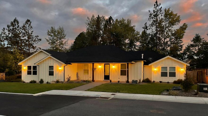 Rare single-level living on nearly an acre inside the city limits of Grants Pass. Built in 2023, this custom home offers 2,571 square feet of thoughtfully designed space in the desirable Twisted Pine community, combining modern construction with room to breathe while remaining minutes from downtown, medical services, shopping, and dining. The interior is bright and open with vaulted ceilings, hardwood floors, chiseled granite counters, and abundant natural light. The kitchen is designed for everyday living and entertaining, featuring a large island, breakfast nook, and oversized pantry. The primary suite provides a private retreat with a spacious walk-in closet and tiled shower, while a dedicated office adds flexibility. Outside, the .82-acre lot offers privacy and usability, complemented by a covered patio and a newly built 24x28 detached shop or garage ideal for vehicles, storage, or hobbies. A seasonal creek creates a natural buffer without limiting usability.