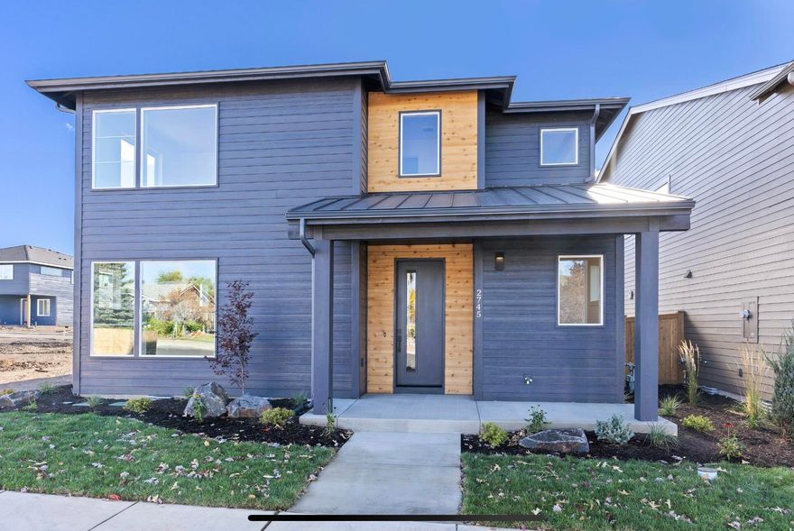 Welcome to this stunning 2,302 sq ft new home by Stone bridge Homes NW, blending modern design with thoughtful details. A charming covered front porch invites you inside to open-concept living with a spacious great room, dining area, and chef's kitchen featuring a large central island, quartz countertops, and a generous corner pantry. Enjoy seamless indoor-outdoor living with a covered patio opening to the fenced backyard. Upstairs, find four bedrooms including a luxurious primary suite with dual vanities, a tile shower and a walk-in closet. A versatile loft, full bath and convenient laundry complete the upper level. Alley-loaded two-car garage adds curb appeal and functionality. Perfectly designed for comfort, style, and everyday living!