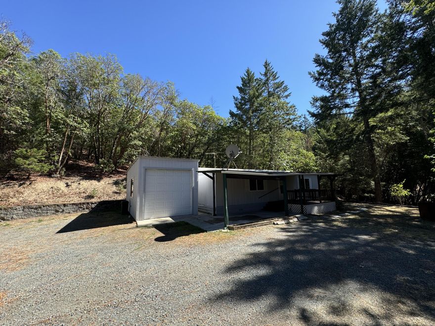 Discover the potential of this home, situated on just over an acre of land that offers a sense of escape. With 1,040 square feet of living space, this property is a canvas waiting for your personal touch. The home is ready for a transformative renovation, yet still holds plenty of potential - a little TLC will go a long way. The property provides a peaceful setting with ample space to create your own private oasis.  A standout feature is the shop space, perfect for storage, hobbies, or projects - this versatile area is a great addition for those needing room for tools, equipment, or creative endeavors. The property also includes a generous driveway, offering plenty of parking for multiple vehicles and easy access for trailers, making it suitable for a variety of lifestyles.  Whether you're seeking a place to build, renovate, or simply enjoy the peace and quiet of rural living, 243 Ewe Creek Road is worth a visit.