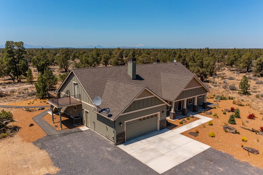 Who says you can't have it all-  Make this beautiful 2020 New Era built home yours today!  Offering quality craftsmanship with thoughtful design as well as privacy and room to roam. Escape the hustle and bustle of the city on this expansive 83+ acre lot with Cascade Mt. Views,  native juniper trees, grasses, & rock outcroppings. This property is fully fenced and adjoins 1,000's of acres of BLM lands on the North and West sides of the property and can easily become your horse property.  No expense has been spared: vaulted ceilings, wood and tile flooring throughout, quartz countertops, matching stainless steel appliances, wine refrigerator, new front loading washer and dryer, 2 gas fireplaces, window blinds, soaking tub, walk-in shower, and heated tile in the bathrooms, California Closets systems in the bedrooms & garage.  2nd story bonus room &Trex decking,  panoramic and expansive terrain views & peek a boo Mt. View's, Tesla EV charger, pumphouse, and 2 outbuilding.