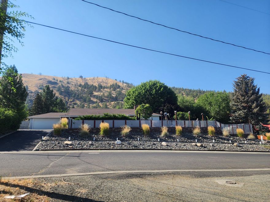 Nice Large Home w/Curb Appeal On Hillcrest! Secluded!  Move In Ready!  Private Setting!  Mt views, .45 of an acre, quiet neighborhood, finished basement, tiled entryway, tongue & groove wood ceilings & walls, galley kitchen w/ appliances & breakfast corner, dining room, living and bonus rooms, utility/laundry room, 3 types of heat, 3 types of flooring, 4 bedroom, 3 bath, 1870 sq ft on the main floor, 1504 sq ft in the basement, breezeway to insulated double car garage, chain link fenced yard w/privacy slats, fish pond w/rock water fall, pre-fab rock privacy fence, raised garden beds, underground sprinklers, drip systems, extensive paver design, brick retaining wall, 2 tin tool sheds, storage shed, concrete area for ½ court basketball.  $449,000 #1101