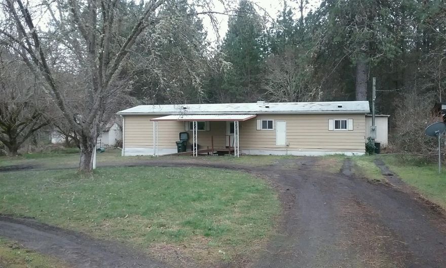Older single wide Manufactured home in good condition on .71 ac.
