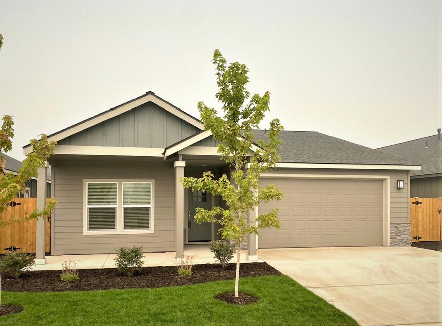 Premier 55+ mature living community in beautiful NW Redmond. Situated just minutes from amenities, medical facilities, the Dry Canyon, trails & parks. Well appointed home w/a comfortable Great Room style floor plan & Master separation. Open kitchen w/massive central island, Quartz counter tops, designer tile back splash, SS appliances & a gas range. Custom cabinetry & classic hardware & fixtures. Luxury wood look flooring throughout main living space, carpet in the bedrooms, vinyl plank in the baths. Spacious living room w/corner gas burning fireplace & plenty of space to entertain the whole family! Master Suite features a tray style vaulted ceiling & huge walk in closet, dbl vanities in the bath & glass shower door. High efficiency gas furnace & water heater, pre wired for A/C. Double car garage w/wi-fi garage door opener, front landscaping, auto sprinklers & fully fenced too. 2''  White blinds installed, move in & enjoy. Last one in this community!