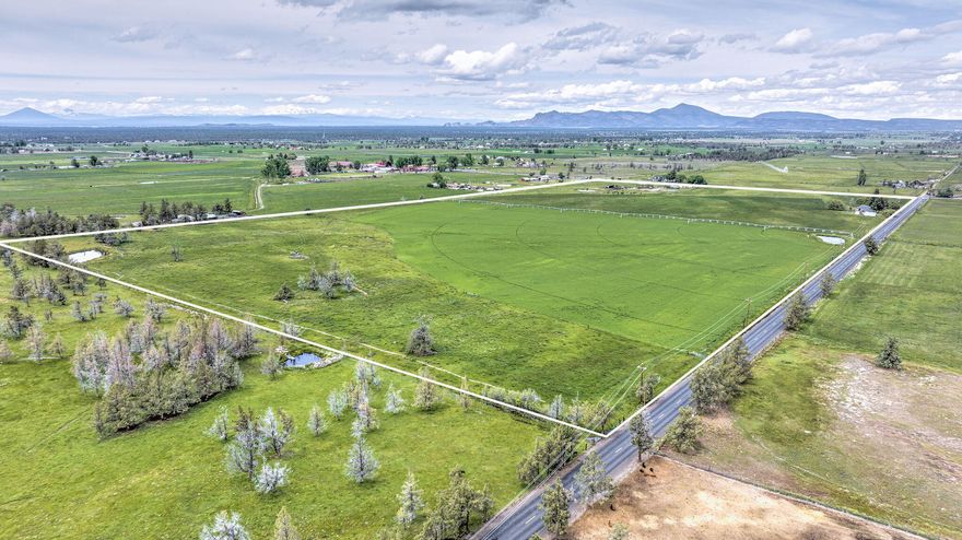 Excellent hay production & rental income! This well managed 77.9 acre farm/ranch with 73 of irrigation includes a 2019 Reinke 6 tower Pivot that is fed off a new pond with a 15hp pump. Approximately 20 acres are planted in 2nd year alfalfa, & 25 acres planted in natural meadow hay. The balance of the irrigated ground is used for pasture that is currently flooded with tarps, but could be switched to gated pipe for convenience. The main home, built in 1964, has been well maintained with excellent rental history (renter would like to stay). This stick built home also includes a detached garage & separate shop/animal shelter. There is also a second manufactured home built in 1997 with 3 bedrooms & 2 baths, perfect for a ranch hand! This ranch is perimeter fenced & cross fenced for easy pasture rotations. Additional improvements include a 2012 pole style hay barn, small equipment shed, loafing shed & small set of working corrals. All this and amazing Cascade Mountain views!