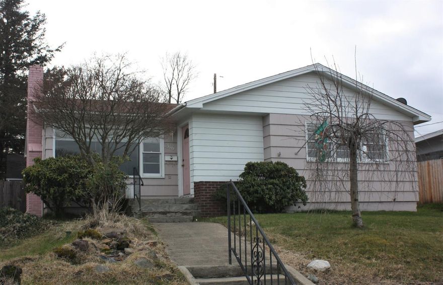 This cottage style home is a delight. It sparkles from top to bottom with fresh interior paint. The living room has a wood burning, brick surround fireplace and the large picture window allows plenty of light and views of the Table Rocks and Roxy Ann. The cute red and white kitchen and dining area are light and bright and all appliances stay, including the washer and dryer. One of the bedrooms has double closets and two of them have ceiling fan lights. The furnace and the garage roof are only about 5 years old. The glass top range and the refrigerator are newer as well and there is hardwood under most of the carpet. This is a great location close to Hedrick Jr High and Roosevelt Elem