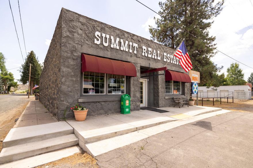 Beautiful older 2800 square foot building next to Big Springs Park and Lost River in Bonanza, Oregon. Six separate spacious offices, could be more. Many recent updates and improvements: paved parking, new concreted front porch electrical upgrades, central heat and air, covered back deck, added insulation, lots of new flooring, phone system, and broad band. Over 1/3 acre on Main St. Rich history as dry goods store, butcher/meat market, and real estate office. Seller is an Oregon Licensed Real Estate Agent.