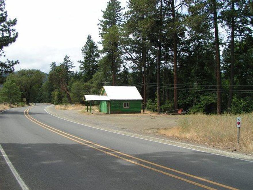 Rare Commercial Property in the Applegate Valley! Centrally Located, and with Applegate River Frontage! Already a well-known River Destination on the Applegate, this Property is perfectly poised to embrace the ever-growing popularity of the Applegate Valley's Local Artisan's Wineries, and Farmers. Generous Zoning allows for Residential Use, as well as numerous Commercial possibilities including Farm Stand, Local Artisan's Store, Vineyard/Wine Stand/Store, Tasting Room, Retail, and more. Existing Older Building, with Well, Septic, and Power on Site. Plenty of Parking, with easy access from Hwy 238 and excellent traffic exposure Don't miss this very unique opportunity in a special location!