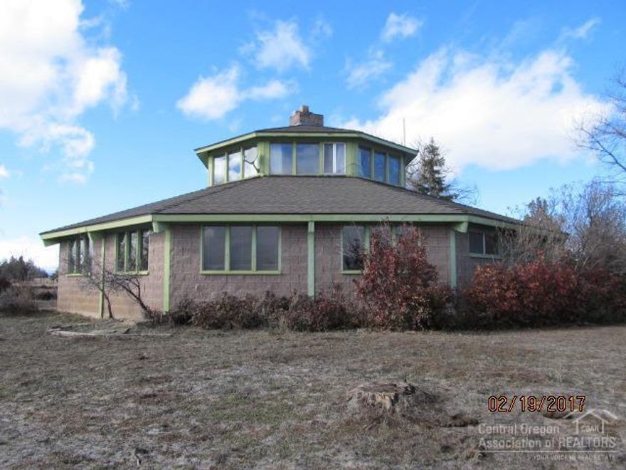 Unique home on 15.76 acres (12.35 acres irrigated), irrigation pond, large detached shop/storage building. 2302SF, 2 beds, 1 bath, loft, indoor atrium. Private setting, fenced. Buyer to verify all information.