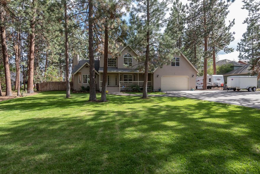 This is special. Live on one generous acre on Hollygrape in Southwest Bend! This traditional home has a sprawling front yard with plenty of parking for cars and an RV. The equally spacious and fenced backyard has two storage sheds, a fire pit (fire pit seating and décor included), horse shoe pit, cornhole, meandering pathway, and a large lovely outdoor deck. It's the perfect place to entertain family and friends and remain socially distant! The home has a bright kitchen with eating space, formal living and dining area, family room, laundry, full bath, and study or additional bedroom on the first floor. There is a separate set of stairs to a large second floor bonus room. Enjoy living in this great neighborhood with none of the CC&R's or association fees.