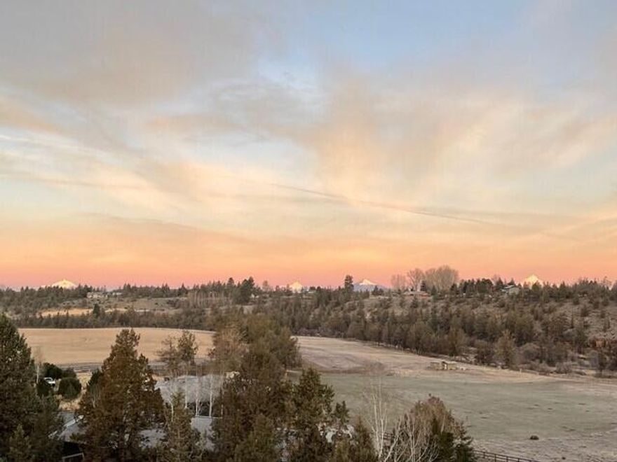 Come live in one of the most beautiful places in Central Oregon - historic Deschutes River Ranch. Enjoy panoramic views of the Deschutes River, Cascade Mountains and East to Smith Rocks from this near new modern farmhouse. Here you will feel like you can reach out & touch Red Tailed Hawks as they soar just off back deck. Sit back & enjoy watching the workings of this gorgeous ranch. There's a professional grade chef's kitchen for the most discerning of tastes. All bedrooms of this single level are en-suite plus an office to enjoy the views while you work & storage galore also. A spacious primary bedroom looking to the river and mountains is separated from guest rooms & has two walk-in closets. The large tandem 3 car garage has a separate workshop, storage attic and there is low RV parking too. This gorgeous community boasts approximately 2 miles of private river frontage & miles of private trails for your enjoyment. The sunsets from the back deck don't get much better than this!