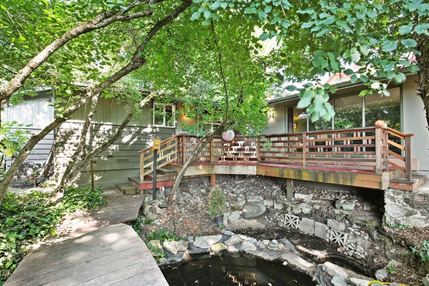 Discover this charming 4-bedroom, 2.5-bath home in a prime Medford location—just minutes from schools and the Rogue Valley Country Club (yes, even golf cart distance!). Thoughtful craftsman details, abundant natural light, and skylights bring warmth and character throughout. Enjoy the peaceful koi pond, water feature, mature shade trees, and fully fenced yard with alley access and RV parking.