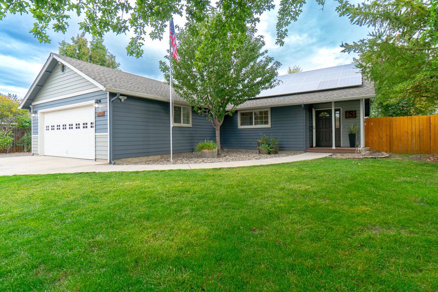 Looking for elbow room? This is it! Located in southwest Redmond on a quiet street sits this 1860 SF 3 bedroom plus bonus living space that could be a 4th bedroom and separate office space,(updated photos of bonus space and office coming soon)  2 bathroom single-level  home on .27 acre. Vaulted ceilings, tons of updates including flooring, cabinets and both interior & exterior paint plus covered back patio, fenced yard, room for all your toys and full RV hookups. New roof in 2022. Fenced garden area, 2 sheds plus small greenhouse. Attached 2 car garage and solar system that includes an approximate average of $100/month income! This one is truly move-in ready!