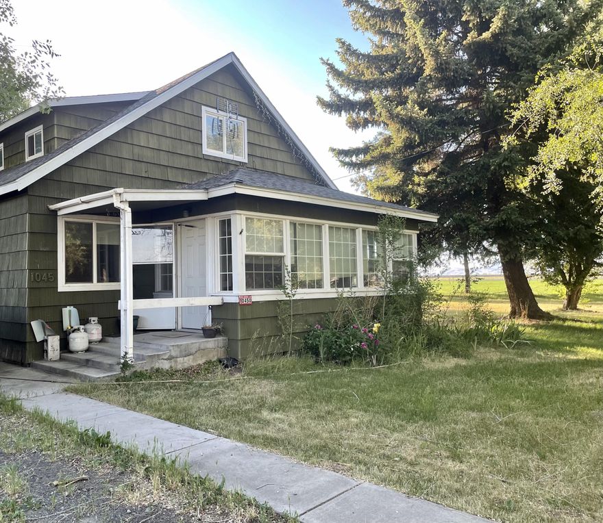 Built in 1937 this 3 bedroom 2 bath home still has some of the unique features and charm that an older home possess. Located  South East of Klamath Falls and in the Henley School district. Two car detached garage with added storage and work space. 9.87 of land that is fenced and cross fenced along with over 9 acres if KID irrigation water rights.