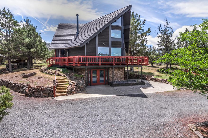 Incredible Cascade Mt & Smith Rock views from this beautiful Chalet style home in Powell Butte. You walk into the home & notice the bright and wonderful openness and then those incredible views hit you. The main level you will find heated floors in the great room, kitchen & dining area. Full bath on main level. Upstairs you will find the open style loft master suite that takes advantage of the windows and light along with the views. The master bath is beautifully done with heated floors, tiled walk-in shower and large walk-in closet. Downstairs is two private bedrooms and an open area that could be used as a bonus area. Tons of storage. The garage is oversized w/attached room behind that could be finished off as a possible bed/bath. Above the garage is a private entrance w/staircase to a storage area that could also be finished as another bonus area. Property sits on 5ac's. Beautiful pergola sitting on pavers to entertain & enjoy the views. 3yr old Daikin Ductless system. Pellet stove.