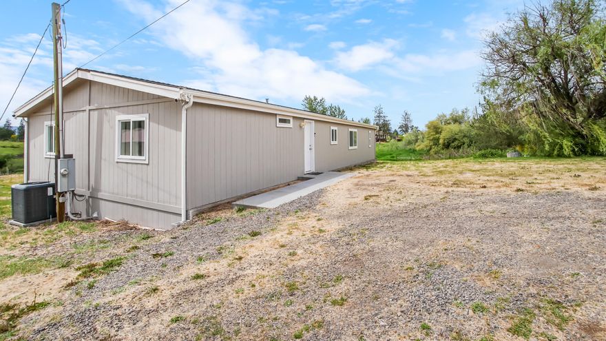 BACK ON MARKET AT NO FAULT OF THE PROPERTY. 
2 HOMES on for the price of one! Priced to SELL fast!!! Recently tested well flow at 17GPM. A great investment property or live in one and rent out the other. Sprawling 17.04-acre oasis with irrigation rights and endless potential! Anchored by a massive 40x80 ft metal shop with concrete floors, 2 roll-up doors, 2 man-doors, windows, and top-tier insulation—perfect for work or hobbies. The property features TWO manufactured homes. The main home (1,620 sq ft, 1985) offers 4 beds, 2 baths, new roof, updated flooring, windows, doors, cabinets, lighting, paint, and deck. Its open kitchen and primary suite with walk-in closet, dual-sink bath, and large shower impress. The second home (920 sq ft, 1979) has 2 beds, 1 bath, and recent updates. With 2 sheds, a huge garden area, and space for RVs, horses, or livestock, this is a rare gem for multi-generational living or income potential. Stunning views seal the deal!