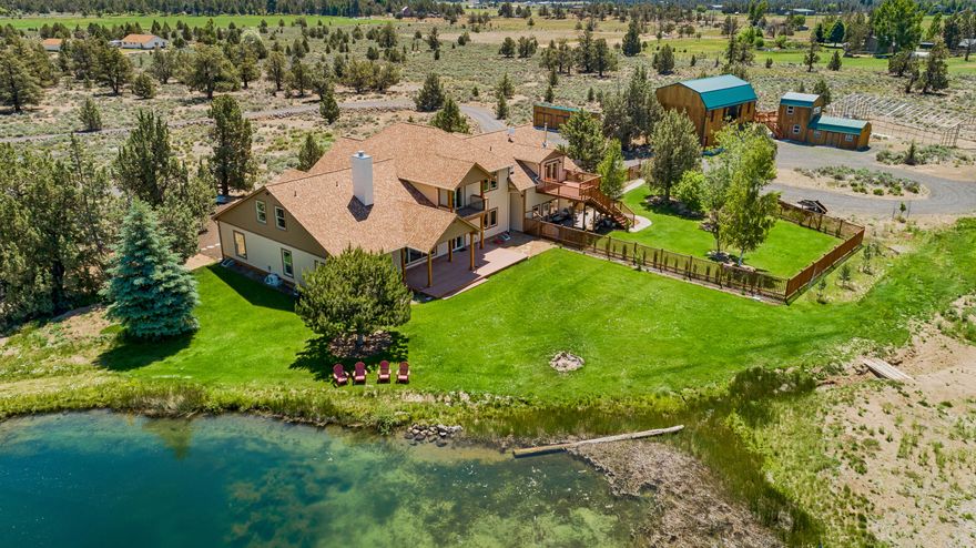 Panoramic Cascade Mtn views and end of road privacy from this newly completed custom home on 40 acres. Main level living
featuring a master suite, great room, formal dining, office, mud room and laundry. Quality and craftsmanship throughout that shows great attention to detail including vaulted T&G ceilings, solid wood floors, custom iron railings, hand carved posts, rock accents and a wood burning fireplace. The spacious kitchen features a farmhouse sink, granite countertops, custom alder cabinetry, a 36'' Viking range, wine fridge and a complete Butler pantry. Abundant natural light adds elegance and warmth, inviting all to relax and take in the views. Upstairs you will find three en suites bedrooms, a large family/yoga/art room in addition to a second laundry room. Let's not forget about the adorable attached apartment/guest quarters with its own private entrance. A well maintained, manicured & fenced property offering a park-like oasis with 6.9 acres of COID Irrigation & a pond