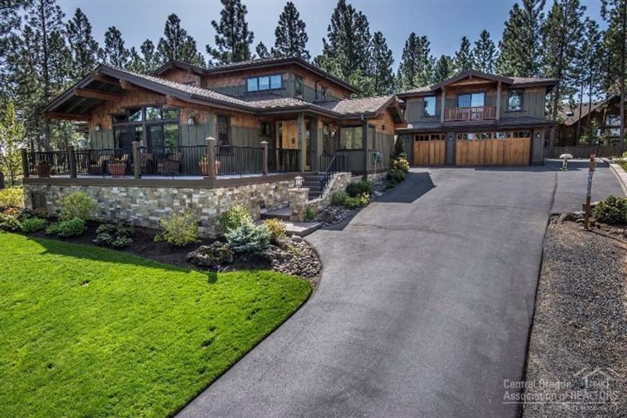 Authentic Craftsman style home on an Estate Lot, nearly one acre of peaceful & private park-like grounds. Home features great room,rock fireplace, gourmet kitchen, high-end appliances, granite counters & concrete island accented by art glass chandeliers, wide plank hickory flooring, main-level master & en-suite guest room, w/ 3 additional bedrooms upstairs & study/loft, as well as separate guest quarters above the 3 car garage w/ addtl bay for toys. Neighboring .82 acre lot may be also be purchased.